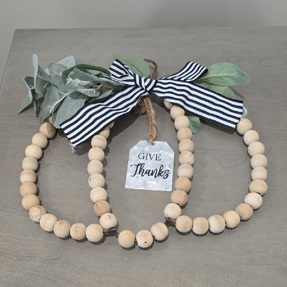 Trendy Boutique Natural Bead Garland with Green Leaves and Striped Bow